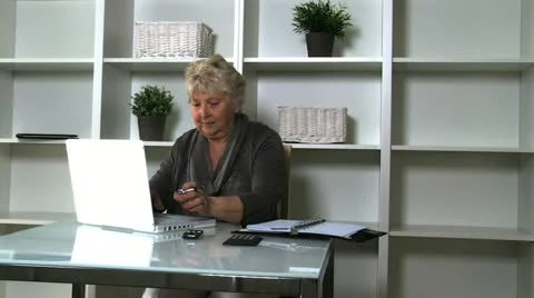 Senior lady on laptop Stock Footage 10833663
