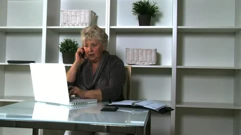 Senior lady on laptop Stock Footage 10833755