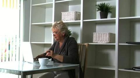 Senior lady on laptop Stock Footage 10837005