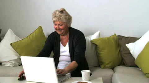 Senior lady on laptop Stock Footage 10837170