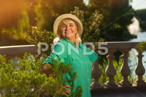 Senior lady on nature background. Stock Photos