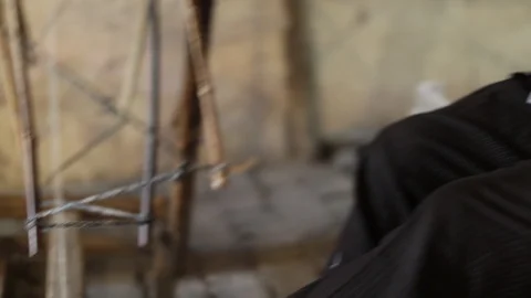 Senior Lady. Sat down spinning wool Stock Footage 97621330