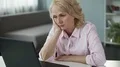 Senior lady sleepy and tired from boring job, needs life changes, lack of energy 4k or 4k+ Resolution