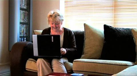 Senior lady using a laptop computer Stock Footage 156131