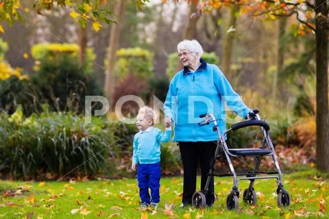 Senior lady with walker enjoying family visit Stock Photos