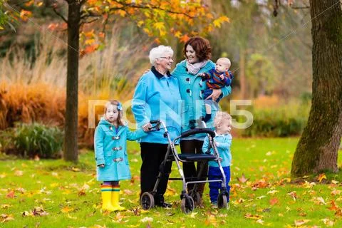 Senior lady with walker enjoying family visit Stock Photos
