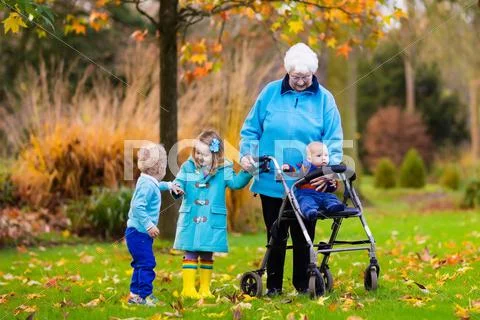 Senior lady with walker enjoying family visit Stock Photos
