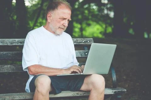 Senior laptop typing Stock Photos