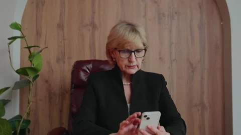 Senior learner using smartphone for online tasks Stock Footage 307417692