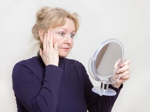 Senior looking in mirror Stock Photos