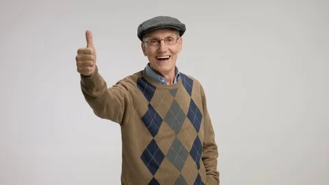 Senior making a thumb up gesture and smiling Video stock 77730323