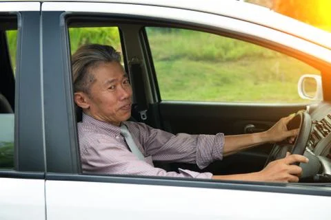Senior male driving Stock Photos