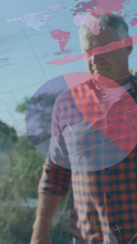 Senior male walking grass path activating HUD for technology pie charts while Stock Footage 332869062