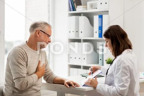 Senior man and doctor meeting at hospital Stock Photos