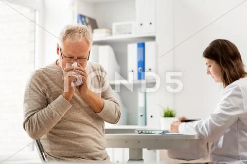 Senior man and doctor meeting at hospital Stock Photos