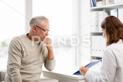 Senior man and doctor meeting at hospital Stock Photos