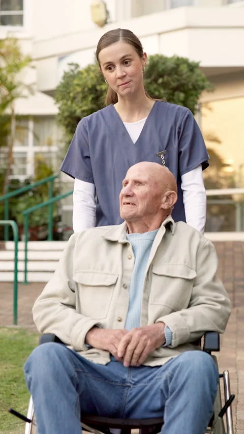 Senior, man and walking with nurse in wheelchair for assisted living, support or Stock Footage 340867390