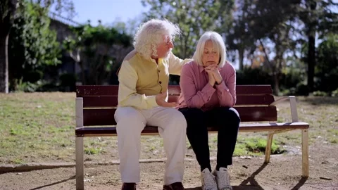 Senior man approaching and talking to his woman with Alzheimer's Vídeos de archivo 260577199