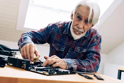 Senior Man Assembling Computer Parts Stock Photos