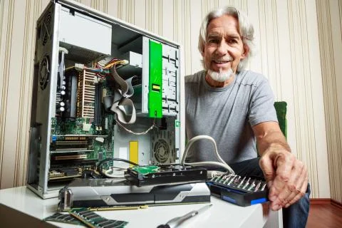 Senior Man Assembling Computer 写真素材