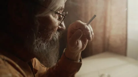 Senior Man with Beard Lighting Cigarette Smoking Alone Indoors Stock-Footage 337573715