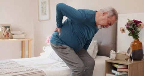 Senior man, bed and back injury with pain from slip disk, nerve or inflammation Stock Footage 274234927