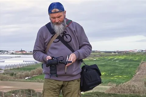 A senior man with a camera. Stock Photos