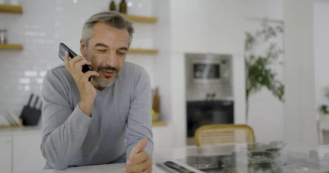 Senior  man with casual cloths work in home office desk using smart phone Stock Footage 342854076