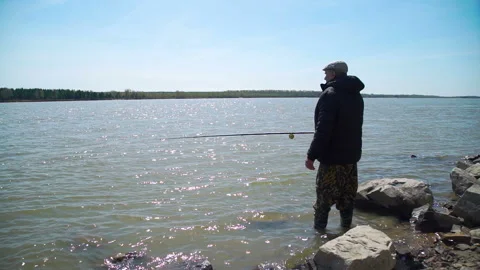 Senior Man Catching Fish in the River Stock Footage 108603439