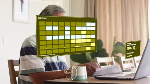 Senior man checking docs at laptop, starting tech scan overlays showing TRUST Stock Footage 337905064