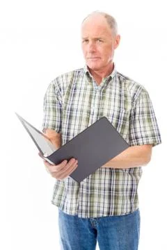 Senior man checking a file Stock Photos