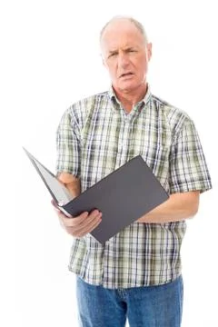 Senior man checking a file Stock Photos
