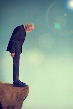 Senior man on a cliff ledge Stock Photos