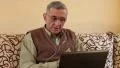 Senior man communicates via laptop. Man with notebook HD Footage