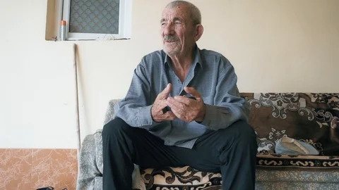 Senior man on couch closeup Stock Footage 95679473