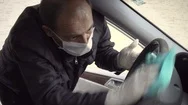 Senior Man Disinfects His Car Stock Footage
