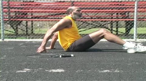 Senior man does balancing exercises Stock Footage 10891797