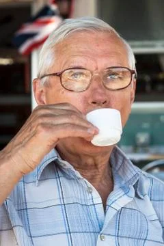 Senior man drinking coffee Stock Photos