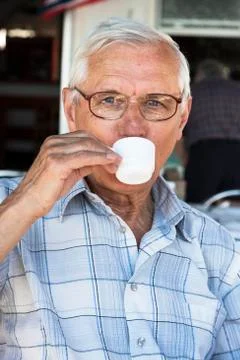 Senior man drinking coffee Stock Photos