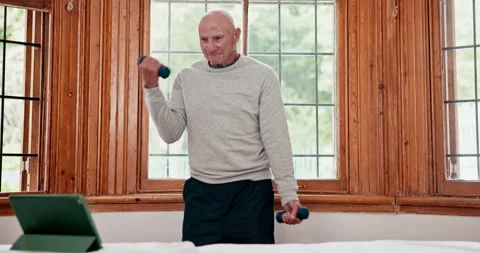 Senior man, dumbbell exercise or tablet in retirement home in online tutorial 動画素材 254808008