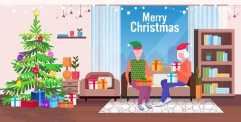 Senior man in elf hat giving present gift box to mature woman family sitting  스톡 일러스트