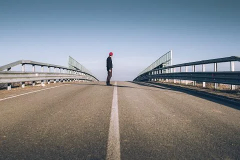 Senior man on the empty road - direction and freedom concept - globetrotter w Stock Photos