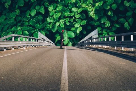 Senior man on the empty road - direction and freedom concept - globetrotter w Stock Photos