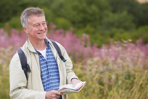 Senior Man Enjoying Hike In The Countryside Stock Photos