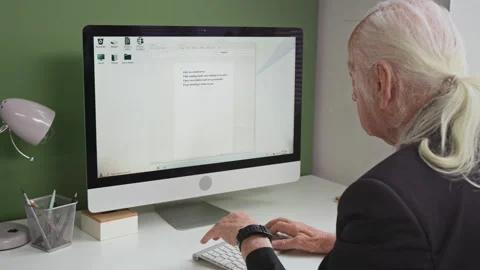 Senior Man Entering Text on PC in Computer Literacy Class Stock Footage 333707400