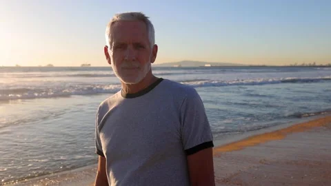 Senior Man Exercising At The  Beach Video stock 147738014