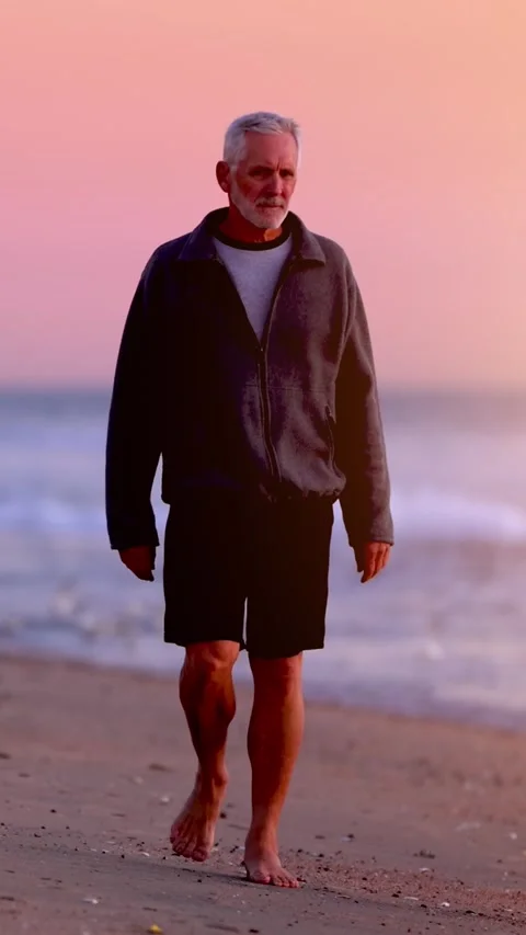 Senior Man Exercising At The Beach. Vertical Video. 動画素材 292422761