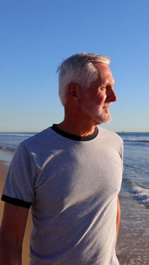 Senior Man Exercising At The Beach. Vertical Video. Video stock 300622404