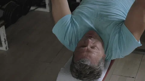 Senior man exercising with disk weight Video stock 61640609