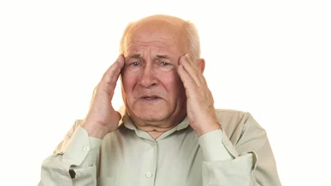 Senior man experiencing intense headache while rubbing his temples Stock-Footage 311944074